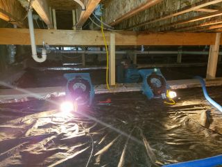 Flood cleanup and drying equipment in use at a residential property.